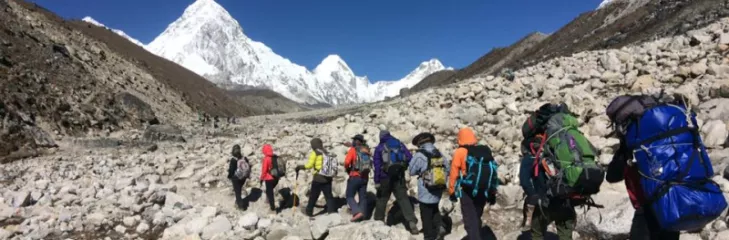 Porter carry backpack heading to Everest base camp